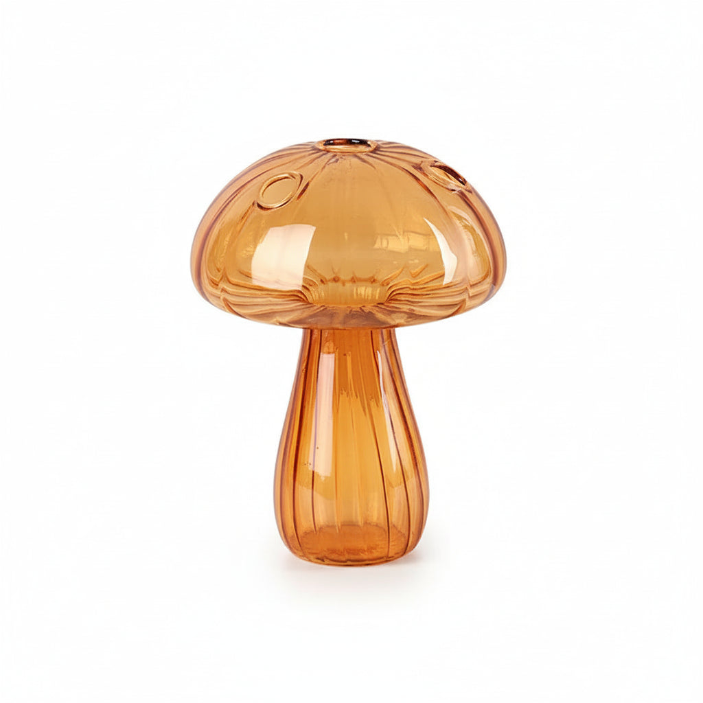 Amber glass mushroom-shaped lamp on a wooden base with a beige background
