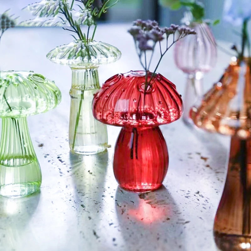 Colorful mushroom-shaped vases on a marble surface