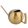 Gold-colored watering can on a white background